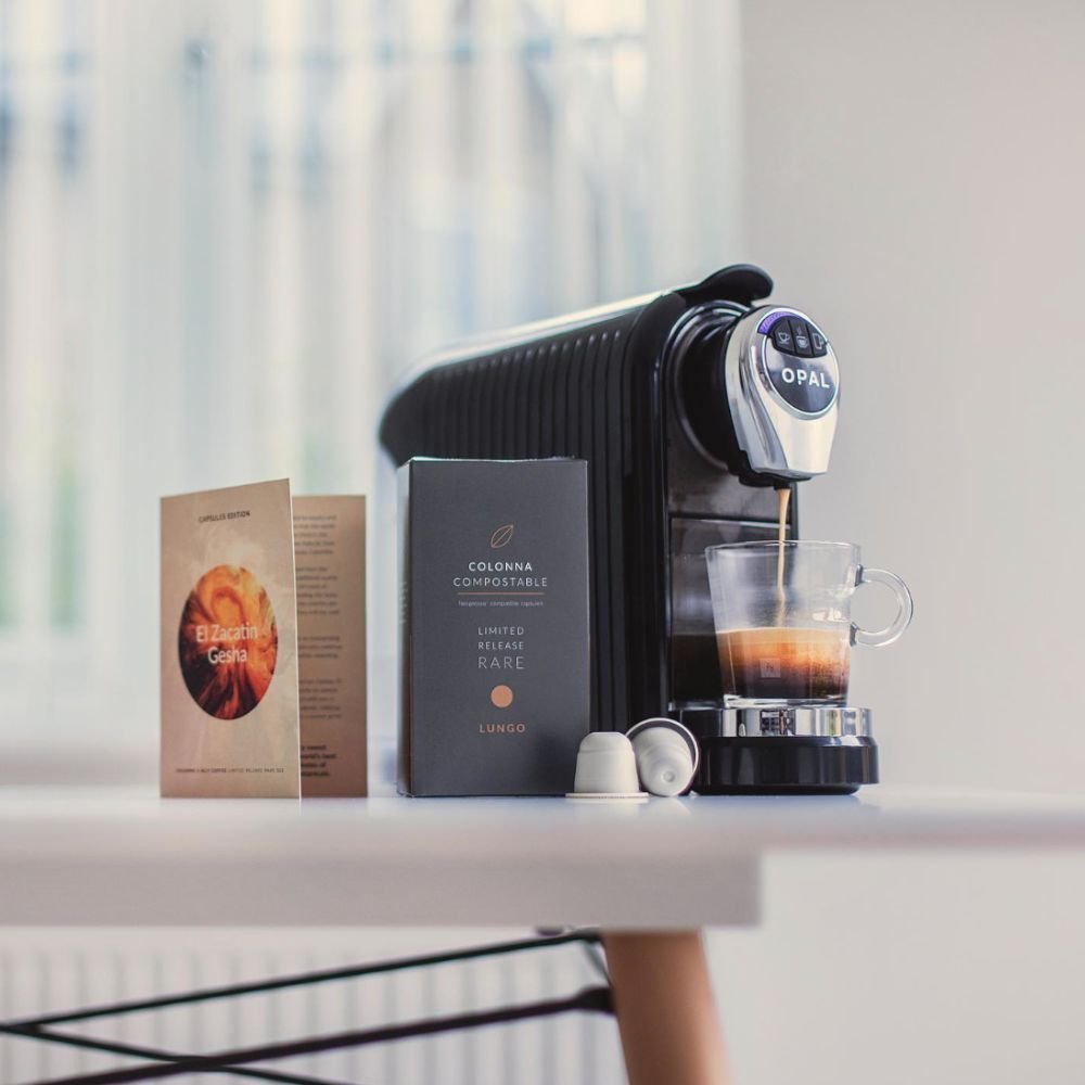 The Best Coffee Pod Subscriptions UK 2026 (Top 8) 9 A Colonna capsule box beside a pod machine brewing espresso
