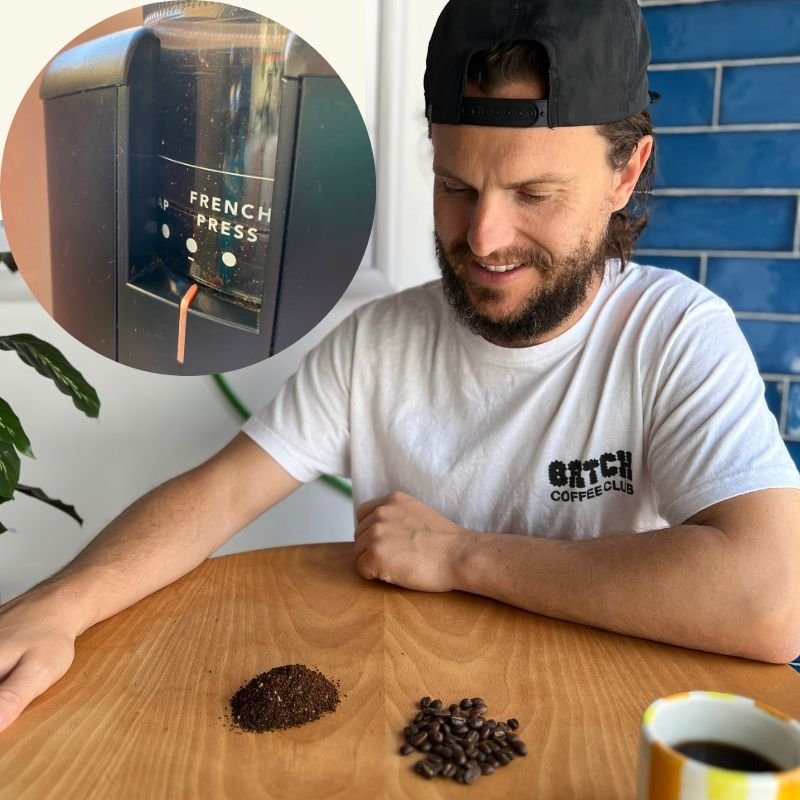 Tomwithgroundcoffeeandacoffeegrinder 5 Questions to Ask Before Buying An Electric Grinder