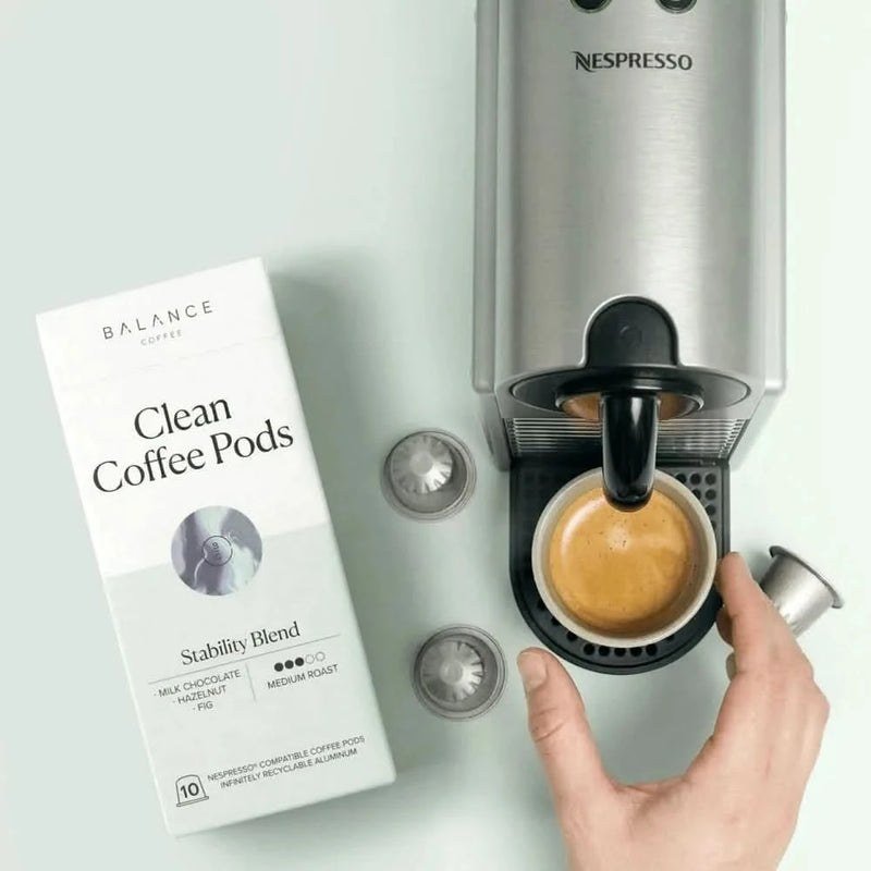 The Best Coffee Pod Subscriptions UK 2026 (Top 8) 12 A Nespresso machine brewing a Balance coffee pod into a glass cup beside the pod box
