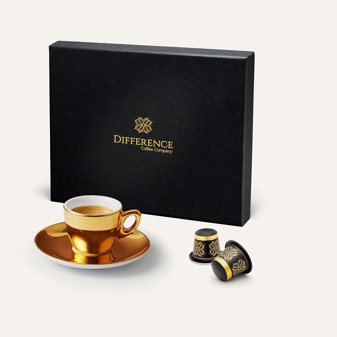 The Best Coffee Pod Subscriptions UK 2026 (Top 8) 3 A black box of Difference Coffee Brazil Yellow Bourbon capsules beside two capsules and a gold espresso cup