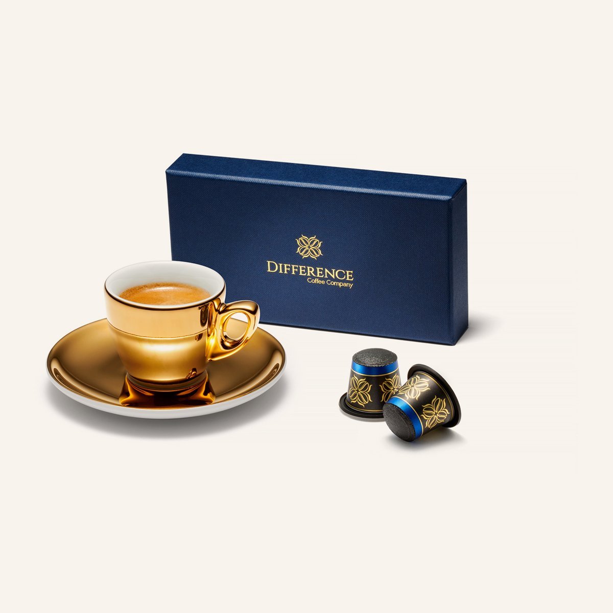 The Best Coffee Pod Subscriptions UK 2026 (Top 8) 4 A navy box of Difference Coffee Jamaica Blue Mountain capsules beside two capsules and a gold espresso cup
